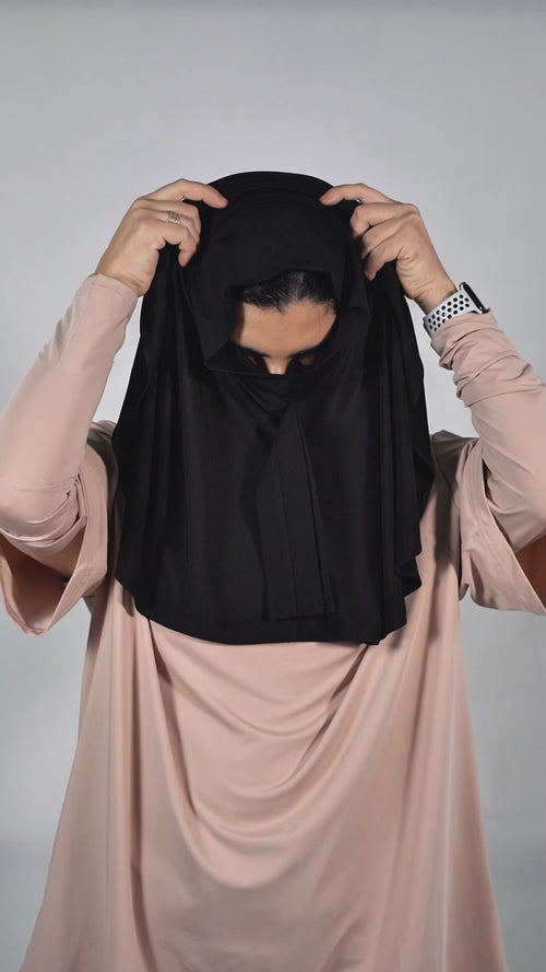 Muslim woman in black sport hijab wearing beige modest active top — TURAYA MOVE Canada
